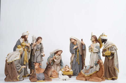 Complete grey and gold 12-piece nativity scene with camel on white studio background showing full crèche arrangement