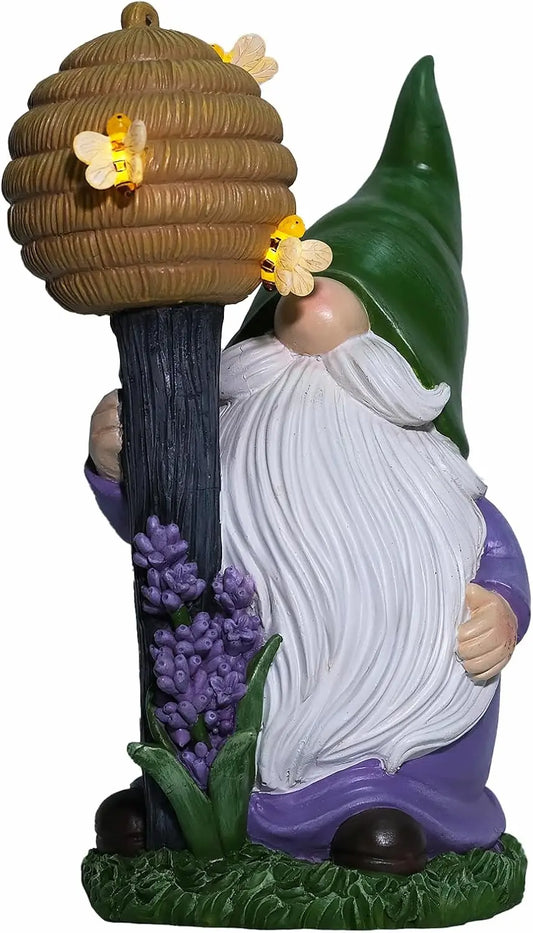 outdoor gnome figurine close-up with green hat, beehive staff, and bee LED lights