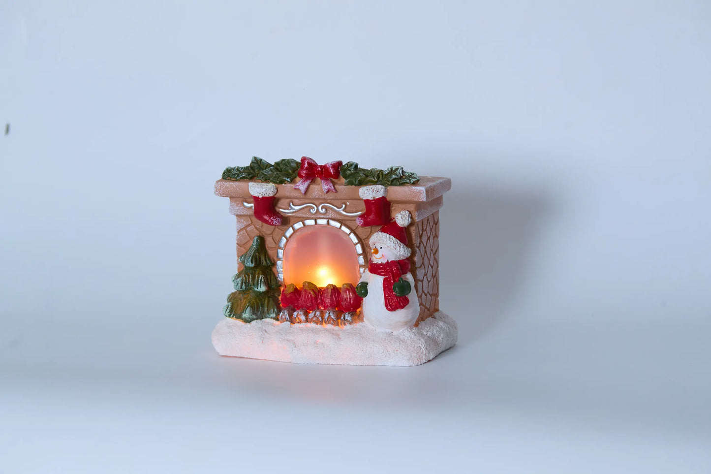 Christmas fireplace snowman decor side angle view showing mantel details