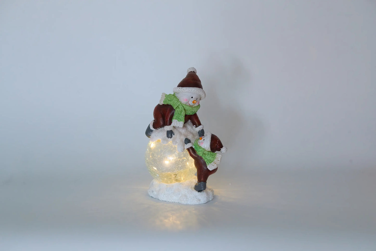 Lighted snowman figurine with warm white LED crackle-glass sphere
