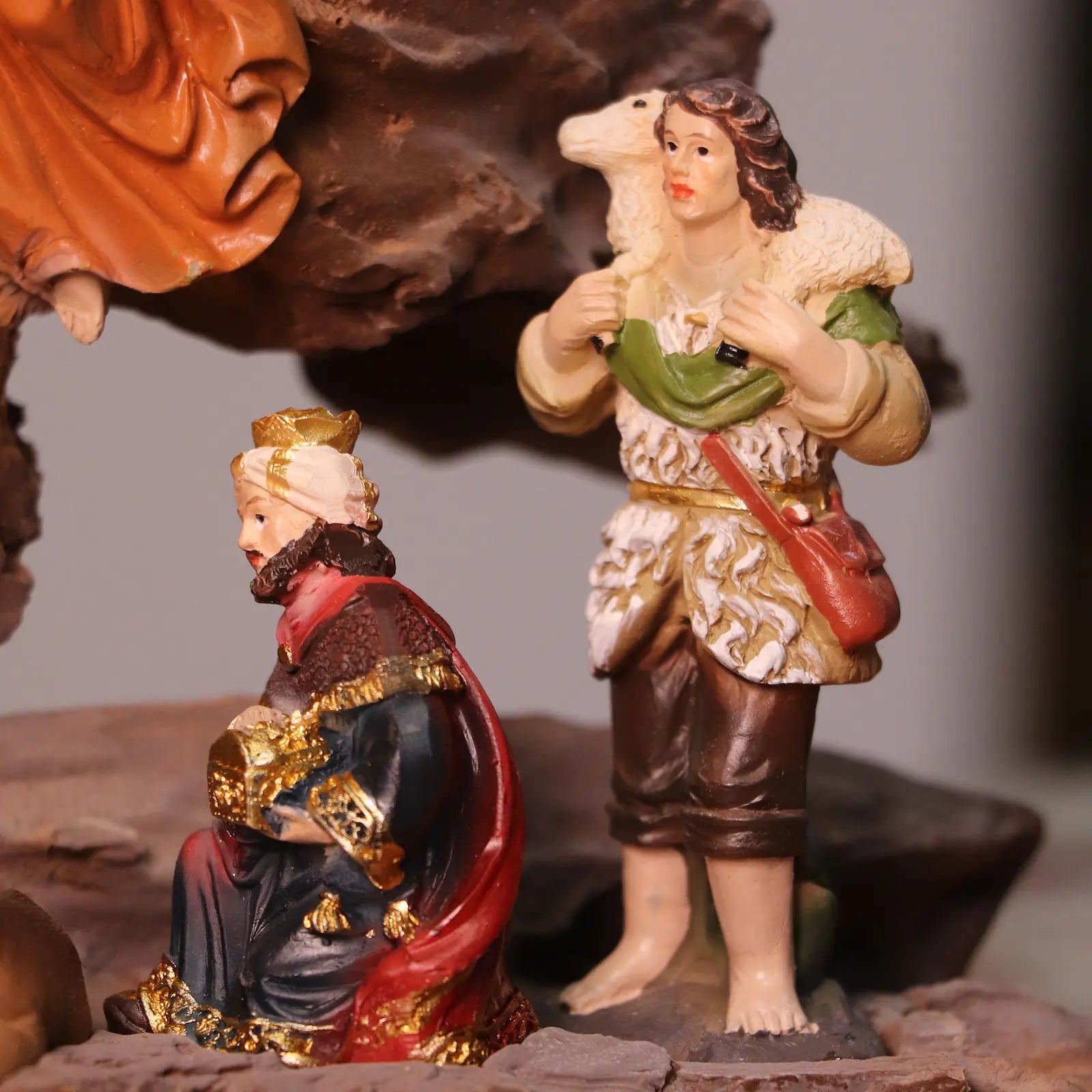 Shepherd and king figurines included in traditional nativity scene decoration