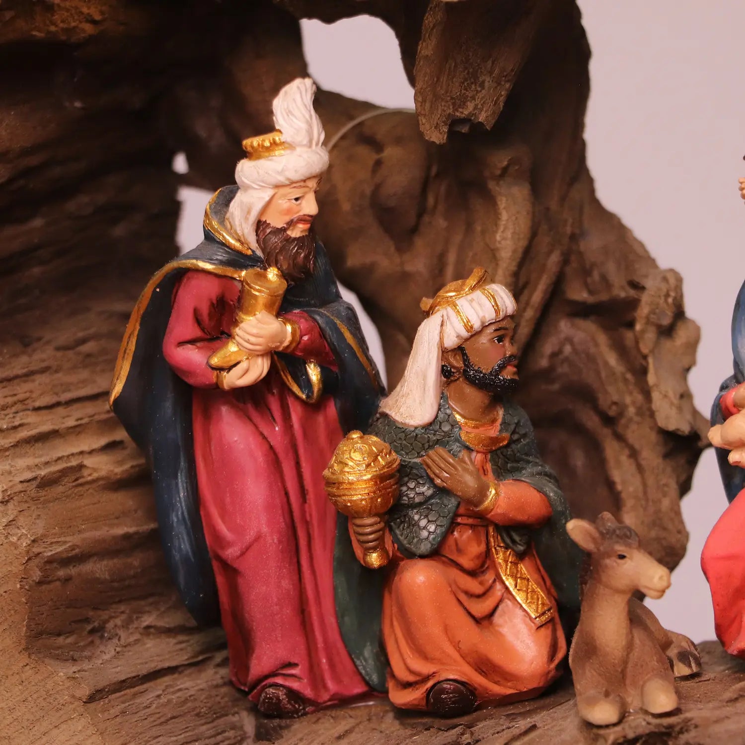 Detailed close-up of Three Wise Men bringing gifts in traditional nativity manger display