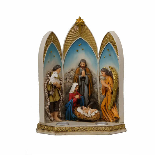 A three-panel Nativity scene figurine with gold-trimmed arched panels, showing Mary, Joseph, baby Jesus in a manger, an angel, and a shepherd holding a lamb.
