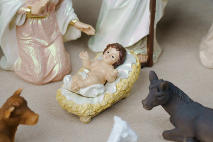 baby jesus in straw manger nativity scene detail