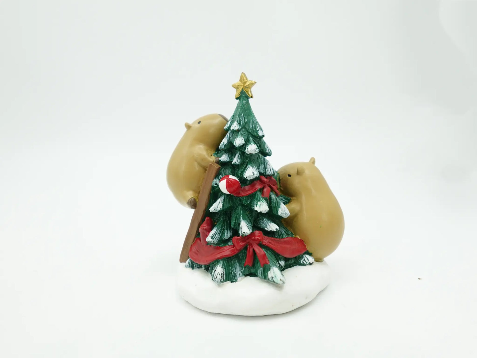the capybara duo decorating tree figurine showing the ladder, candy cane, and gift details on white background