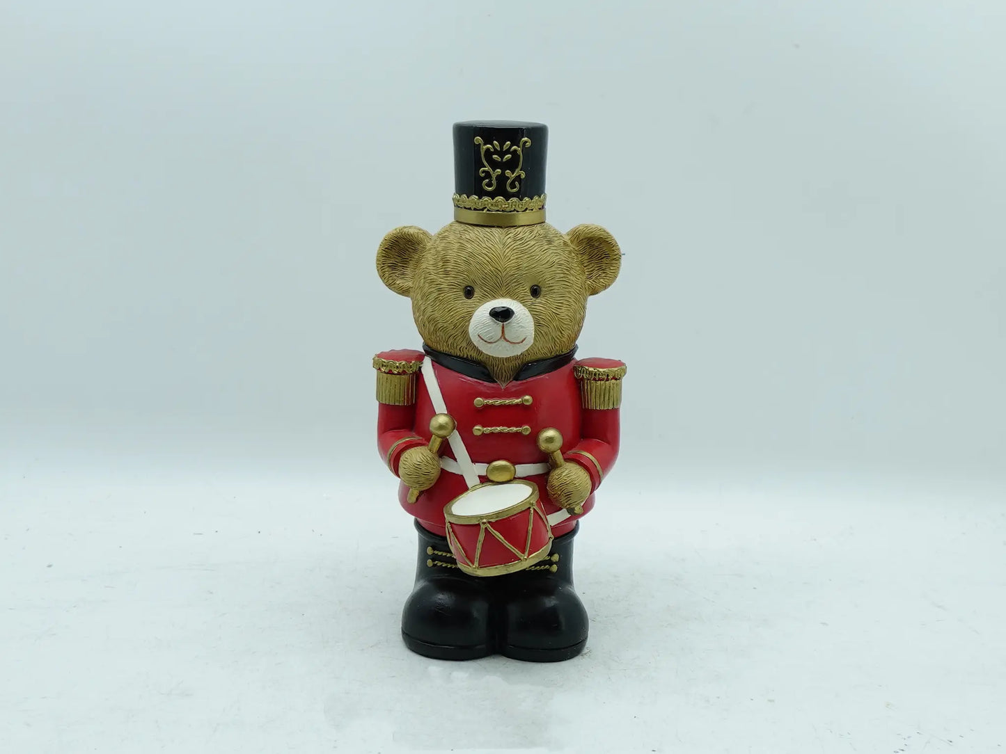 the teddy bear drummer figurine in red uniform, front view