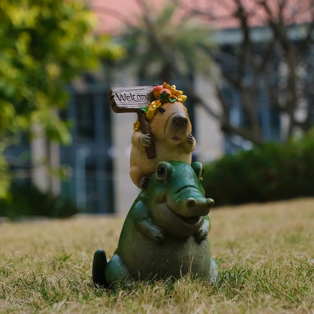 Capybara riding green alligator garden statue