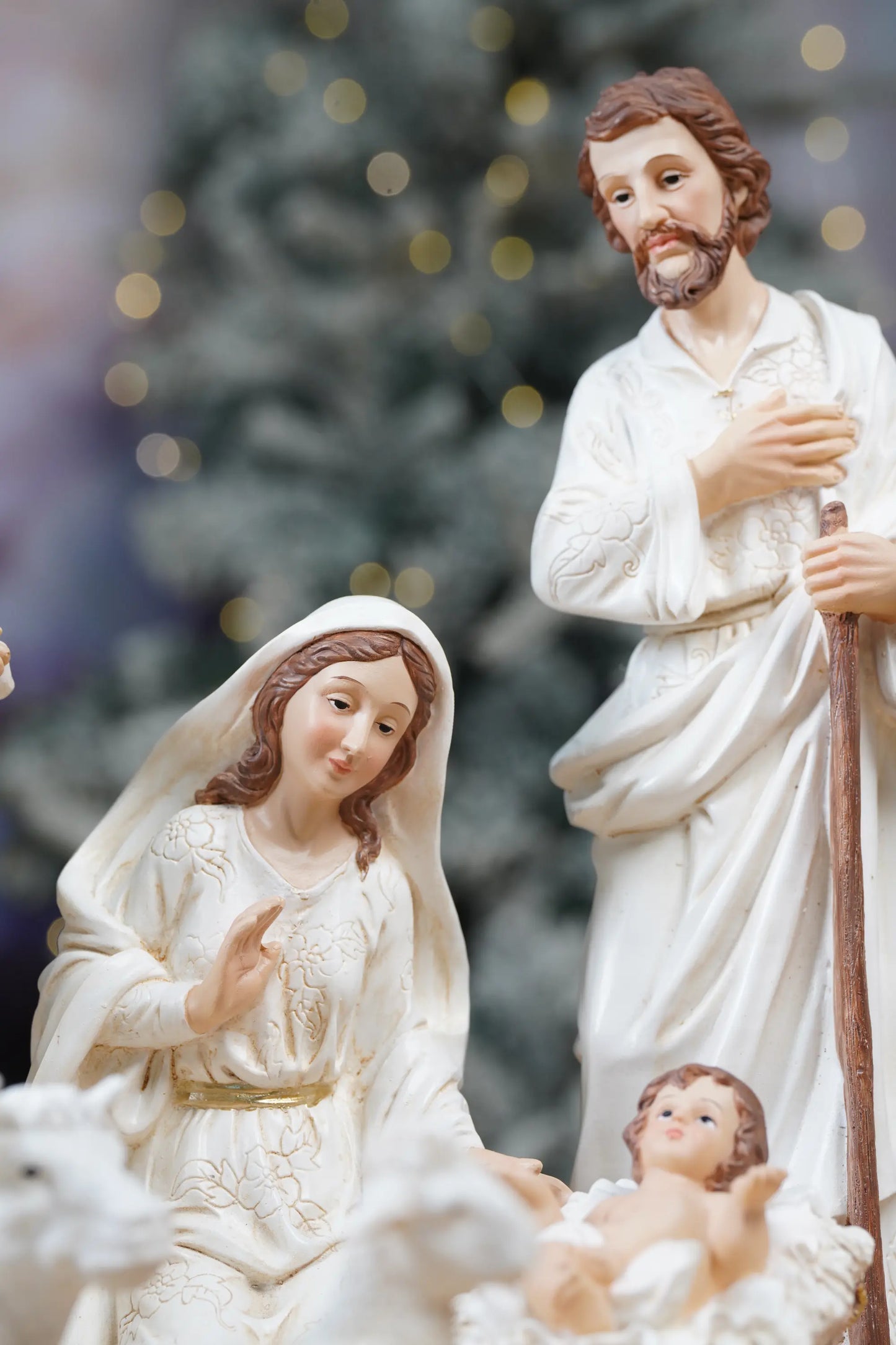 Holy Family nativity figurines set with Mary, Joseph and Baby Jesus in manger, white and gold Christmas decor