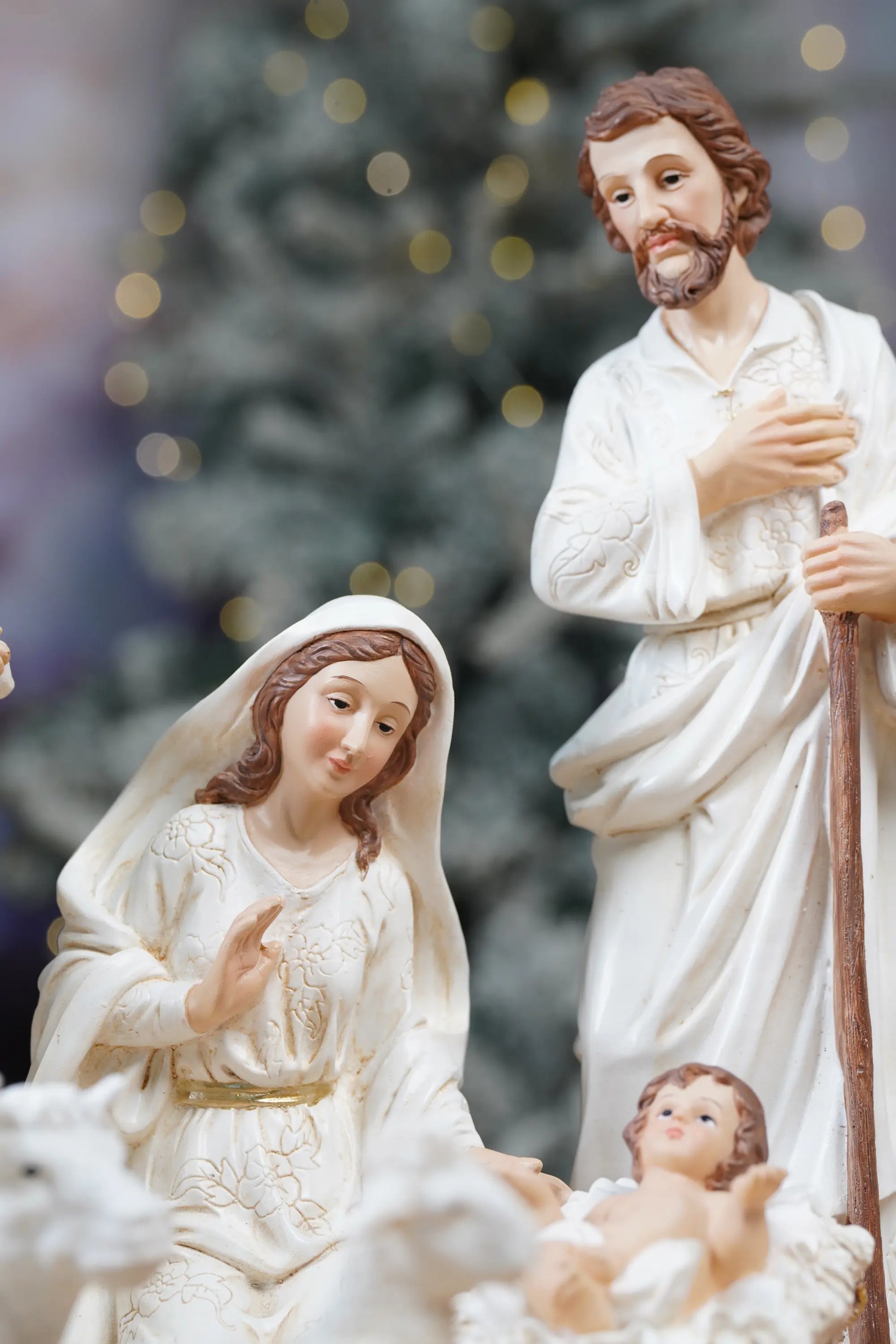 Holy Family nativity figurines set with Mary, Joseph and Baby Jesus in manger, white and gold Christmas decor