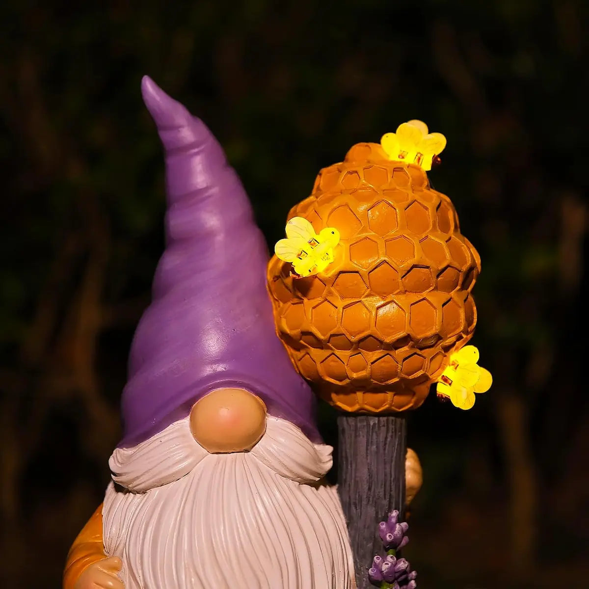  Close-up of honeycomb staff with bee-shaped LED lights on bee garden gnome figurine