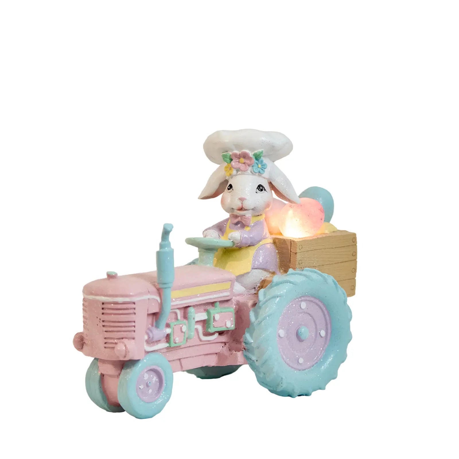 Lighted Easter bunny tractor figurine with glowing pastel egg cargo — battery LED resin spring decoration on white background