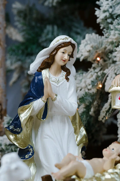 mary virgin mother blue white gold nativity figurine detail
