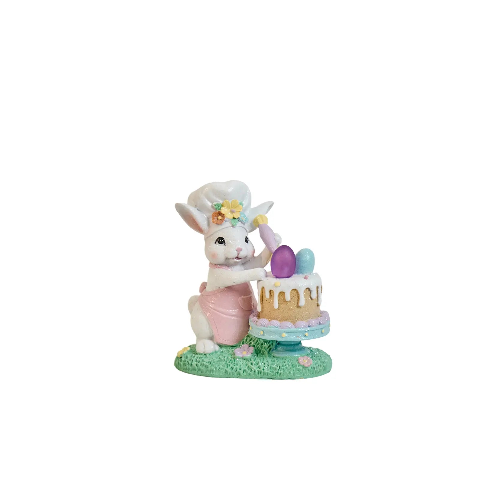 Hand-painted Easter bunny chef figurine decorating a cake with pastel eggs