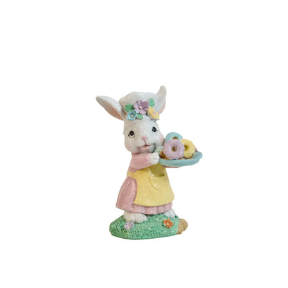 Zayton Easter bunny chef figurine standing with pastel donut tray — hand-painted glitter resin spring decoration on white background