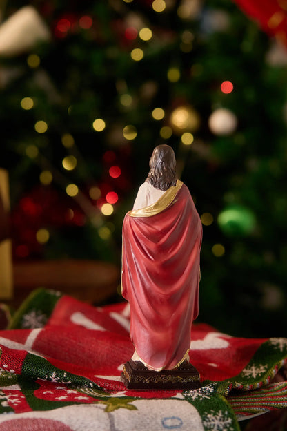 Sacred Heart of Jesus statue showing crimson robe and gold-trimmed mantle, Back view