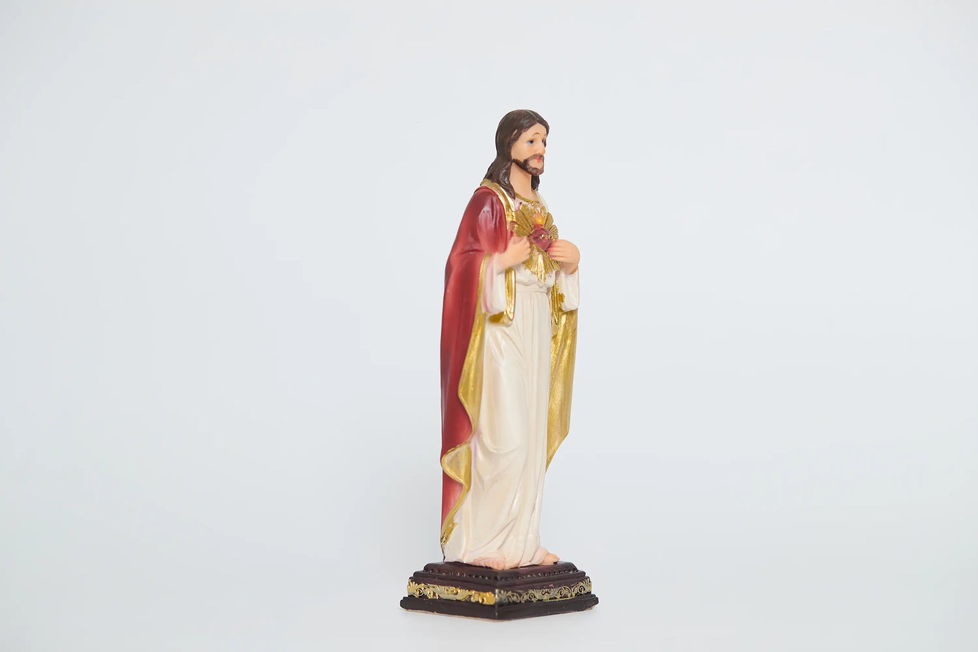 Sacred Heart of Jesus statue showing crimson mantle and gold trim, Side view