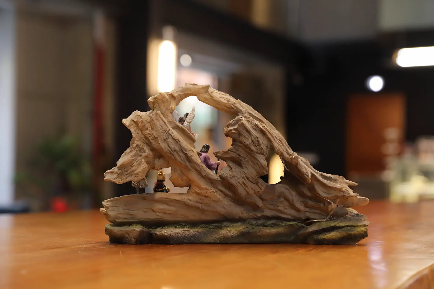 Back view of handcrafted cave style Christmas nativity manger decoration