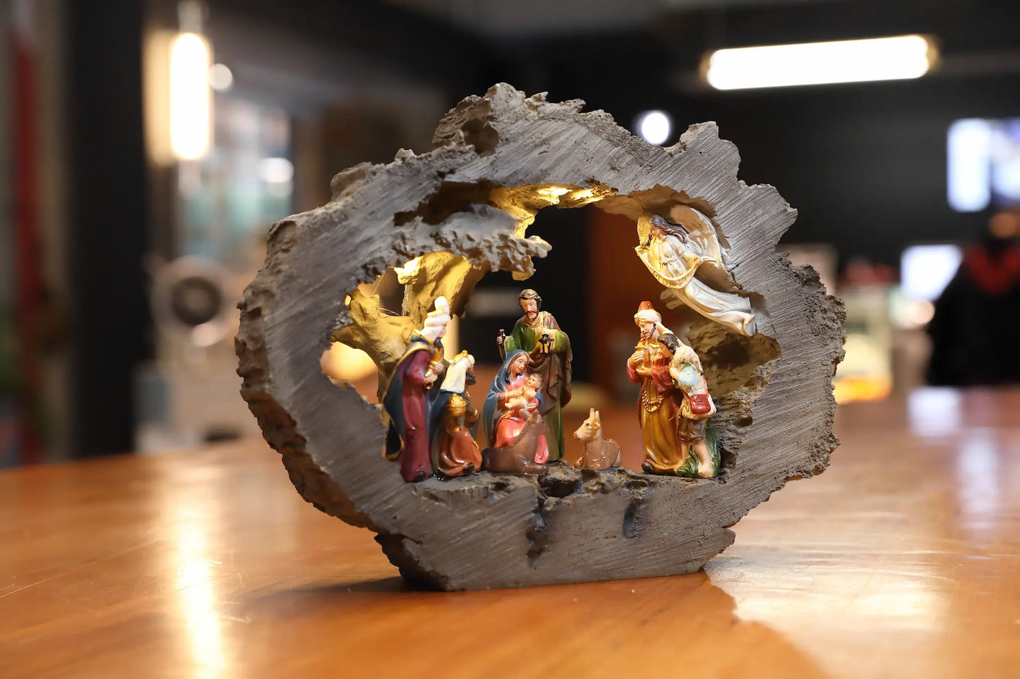 Warm glowing LED nativity scene displayed on tabletop during Christmas season