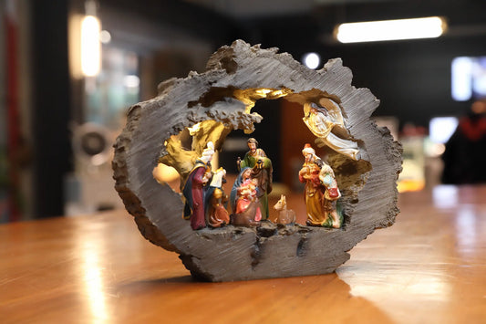 Warm glowing LED nativity scene displayed on tabletop during Christmas season