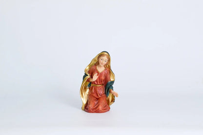 Kneeling Mary figurine close-up, hand-painted nativity figure for Christmas decor.