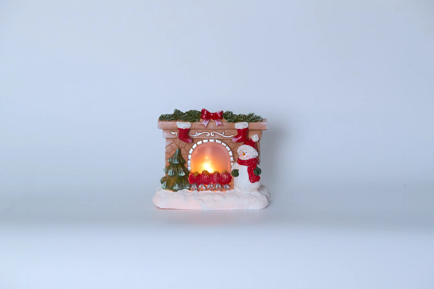 Snowman fireplace figurine front view on white background with warm LED light