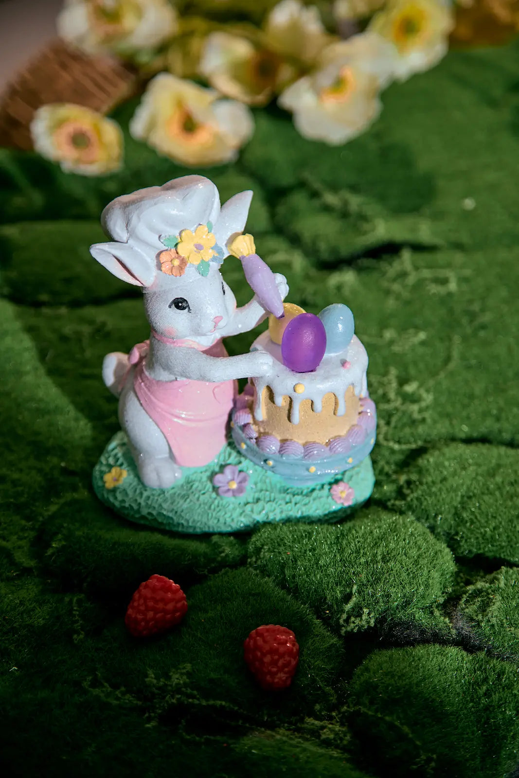 Hand-painted resin bunny chef Easter decor on grass with berries