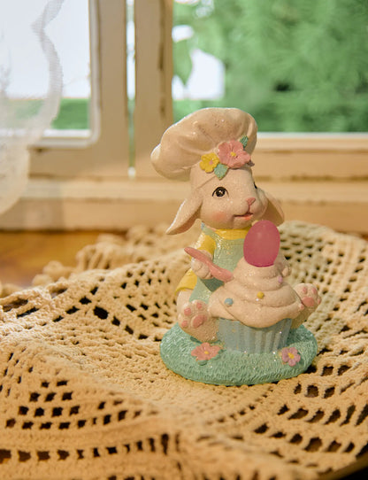 Light-up bunny cupcake figurine on lace doily by window