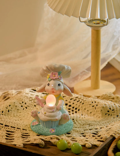 Glowing Easter egg bunny cupcake decor under lamp