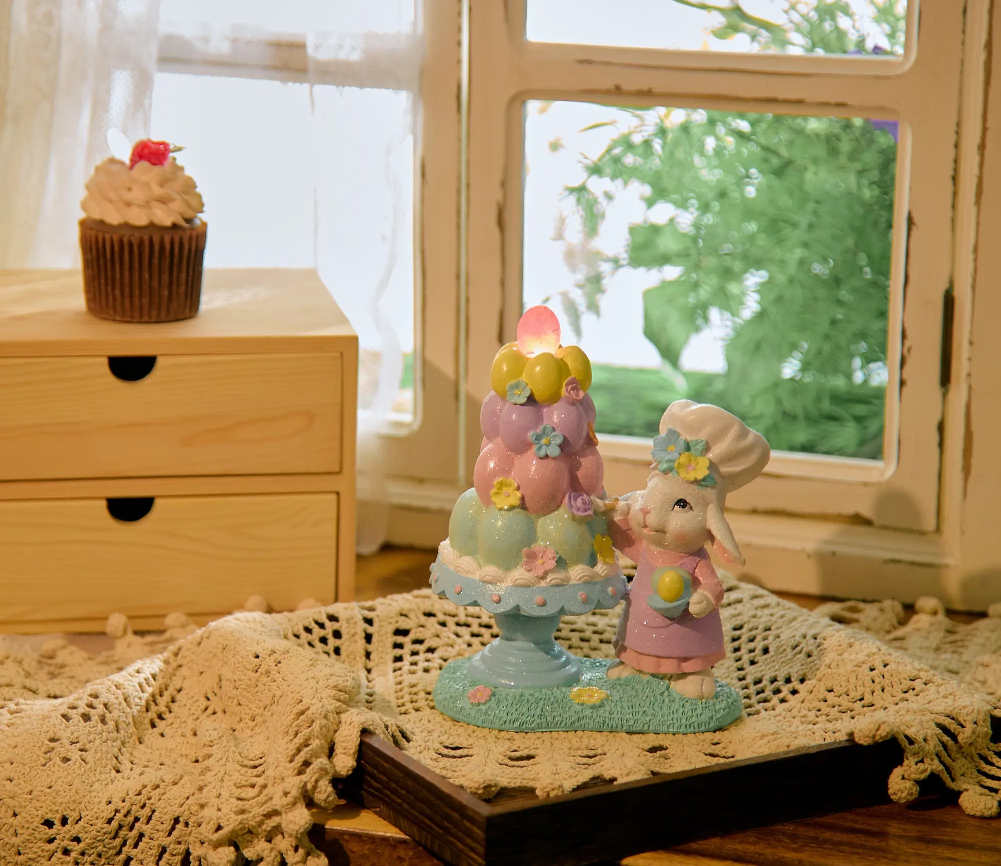  Lighted Easter bunny figurine on crochet doily beside window — battery LED glitter resin spring accent on wood tray in cottagecore home setting
