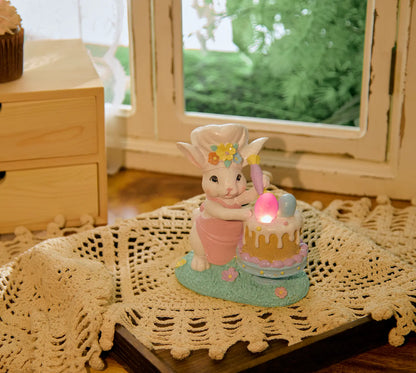 Easter bunny chef LED light decoration on lace doily by window