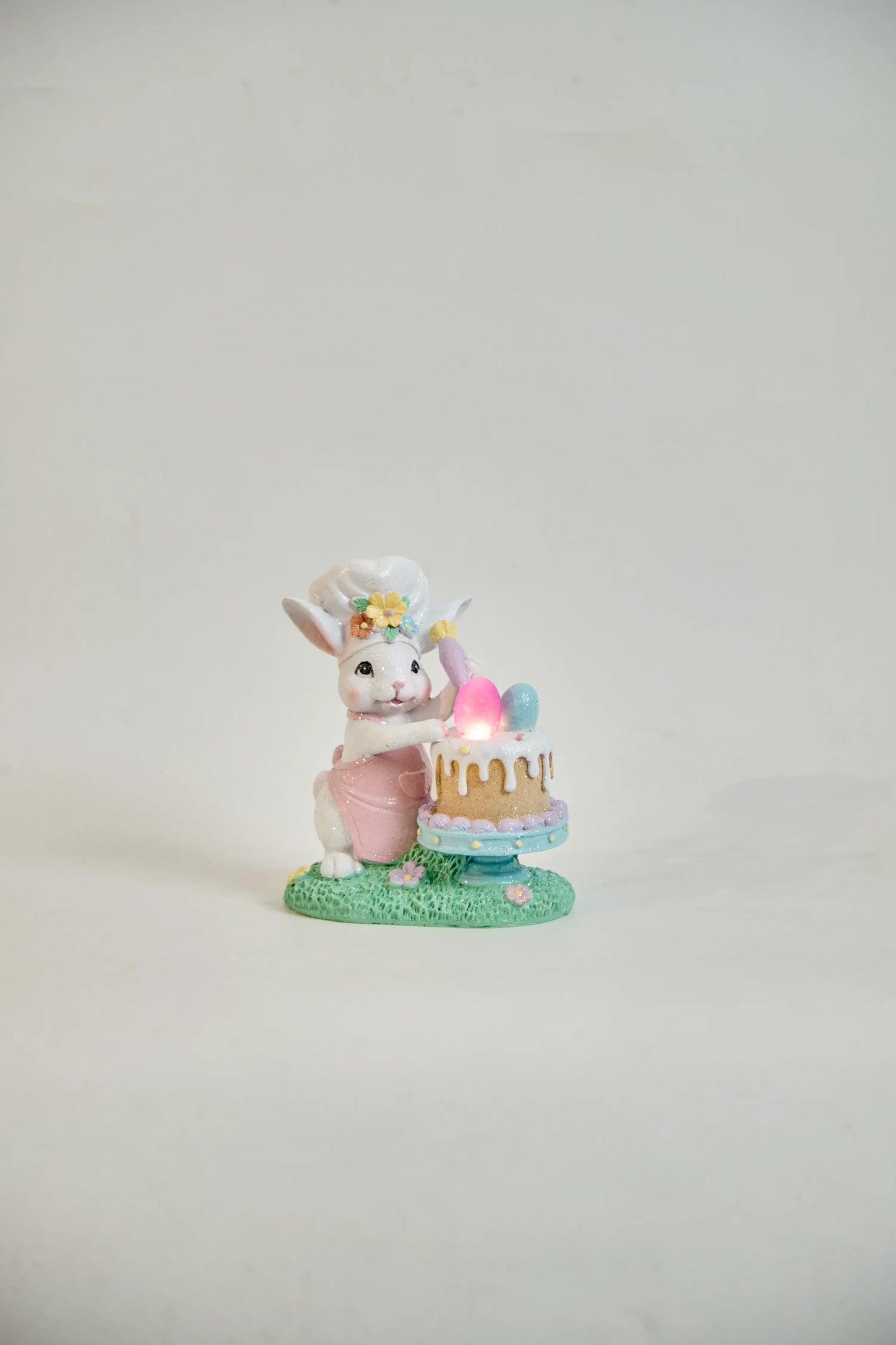 Light-up Easter bunny chef decoration glowing pink egg front view