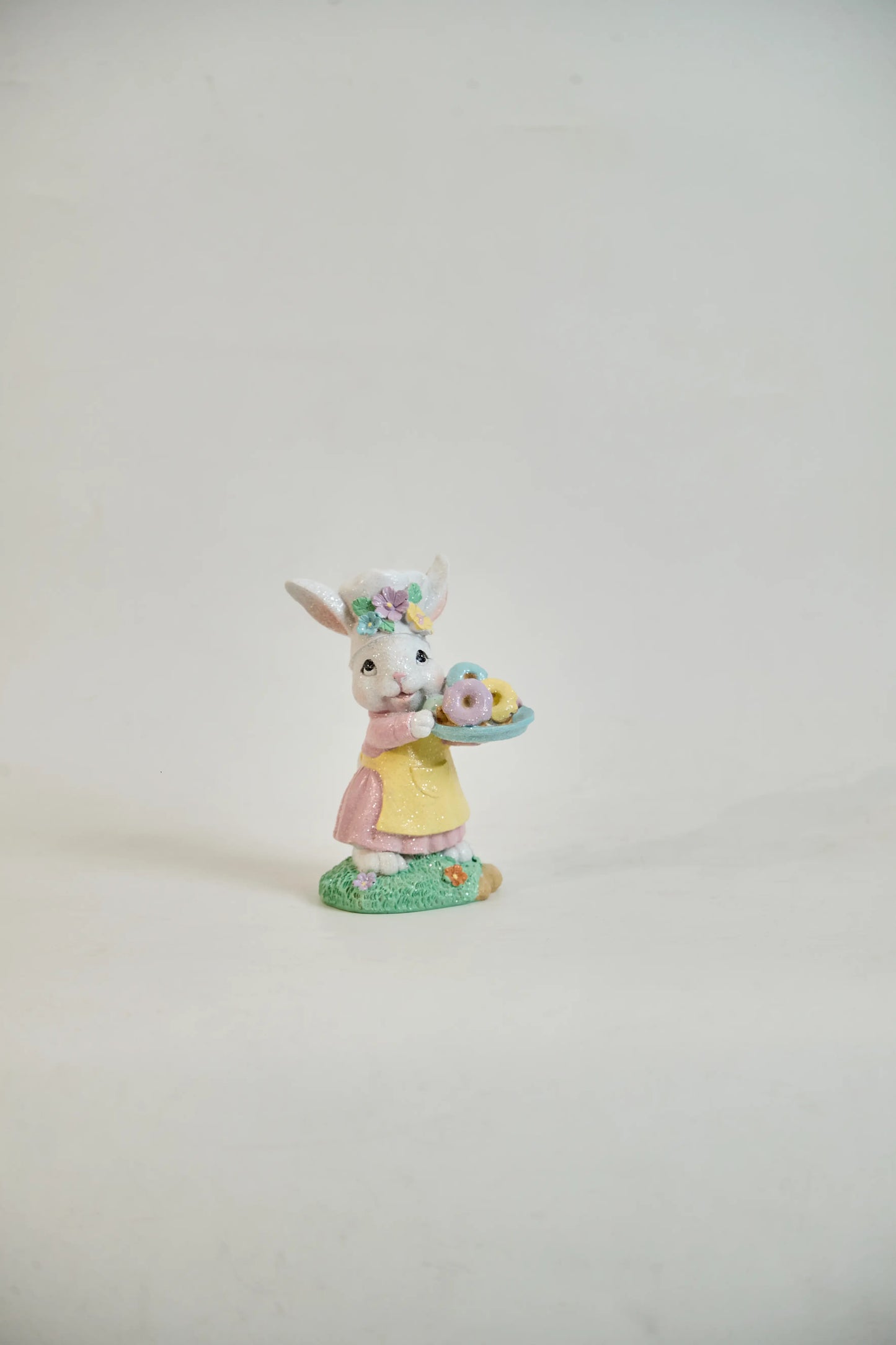 Zayton Easter bunny chef figurine front view, glitter resin spring decoration on neutral background
