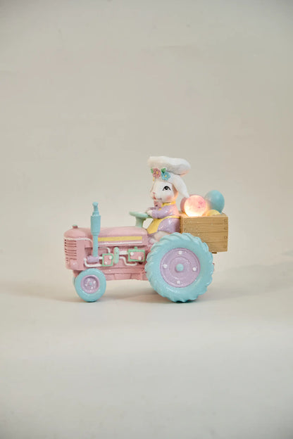 lighted Easter bunny tractor figurine with glowing egg crate — battery LED pastel resin spring decoration