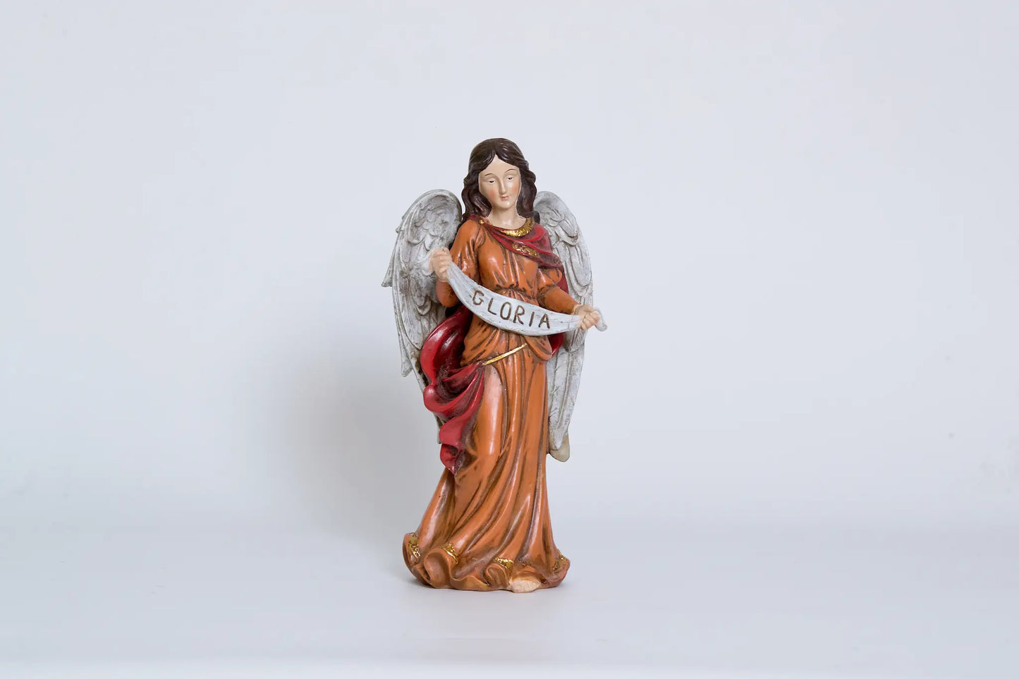 GLORIA angel figurine close-up with gold wings, nativity scene banner angel.