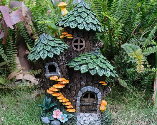 Outdoor garden statue displayed among green ferns and garden plants