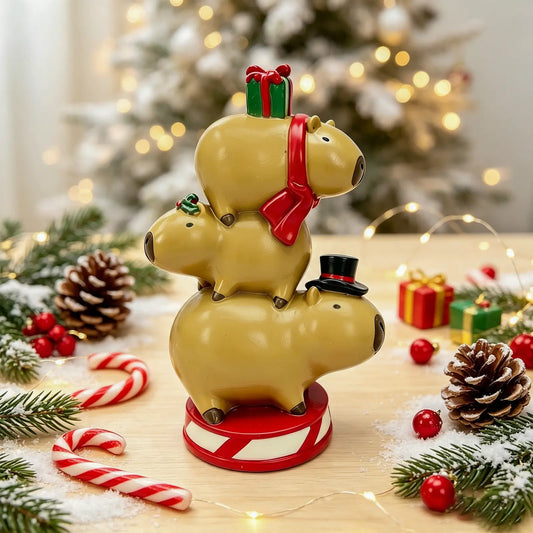 the capybara triple stack tower displayed with candy canes, pine cones, and fairy lights in front of a snowy Christmas tree