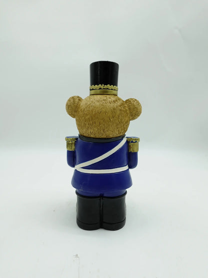 the Christmas teddy bear drummer figurine in blue uniform, back view
