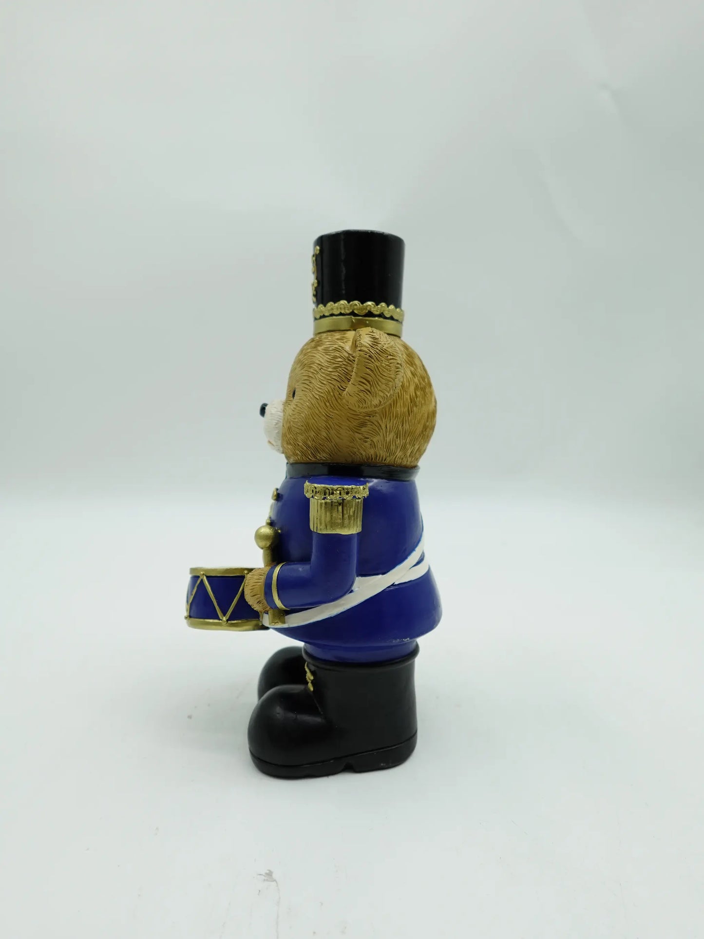 the Christmas teddy bear drummer figurine in blue uniform, side view