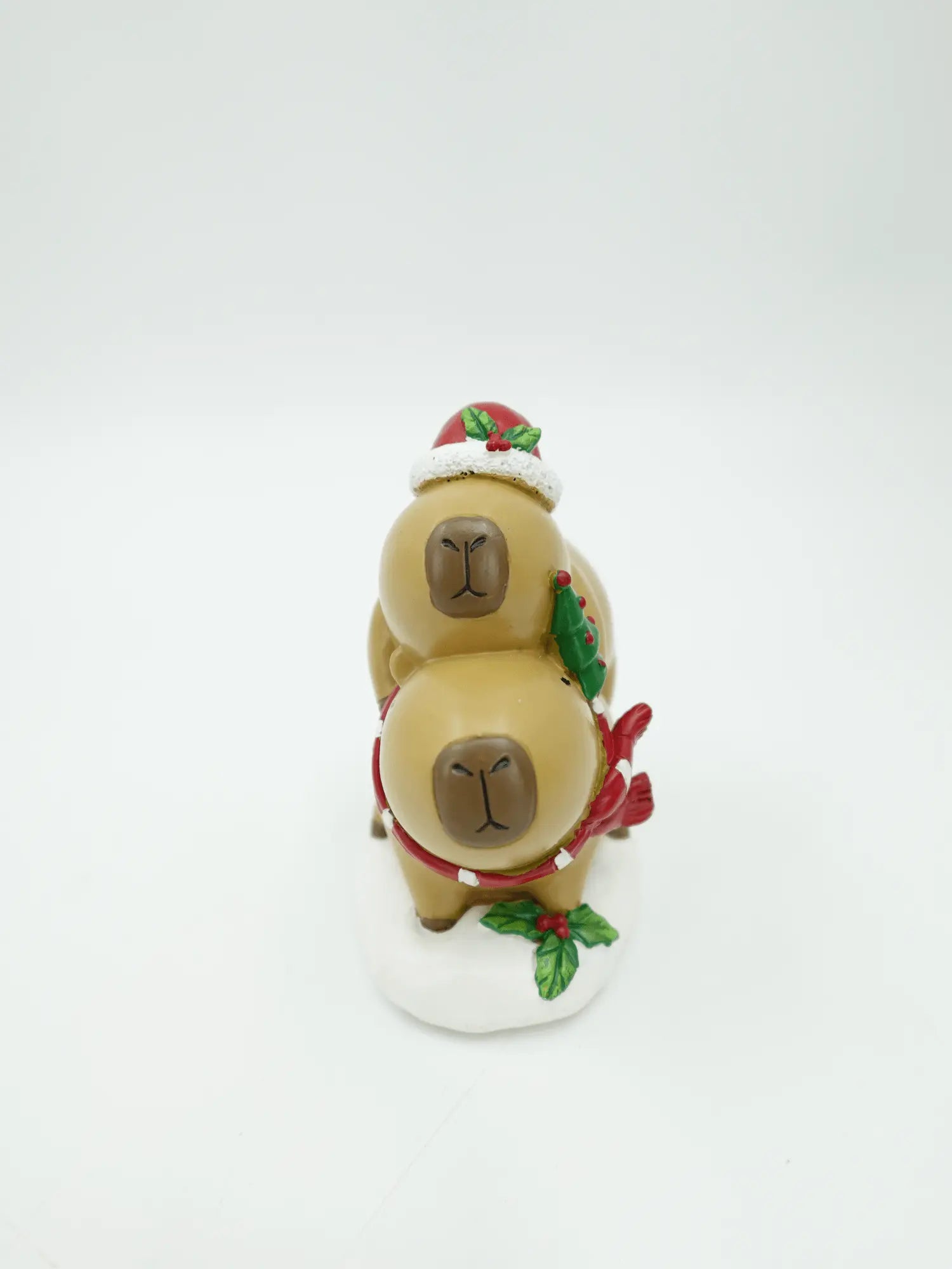 Christmas Capybara Stacking Duo Figurine, standing on a white base against a plain white background.