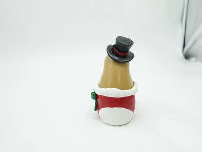 the red Christmas stocking boot showing the white fluffy cuff and green bow detail