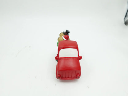 the red truck figurine showing the rounded hood and windshield details