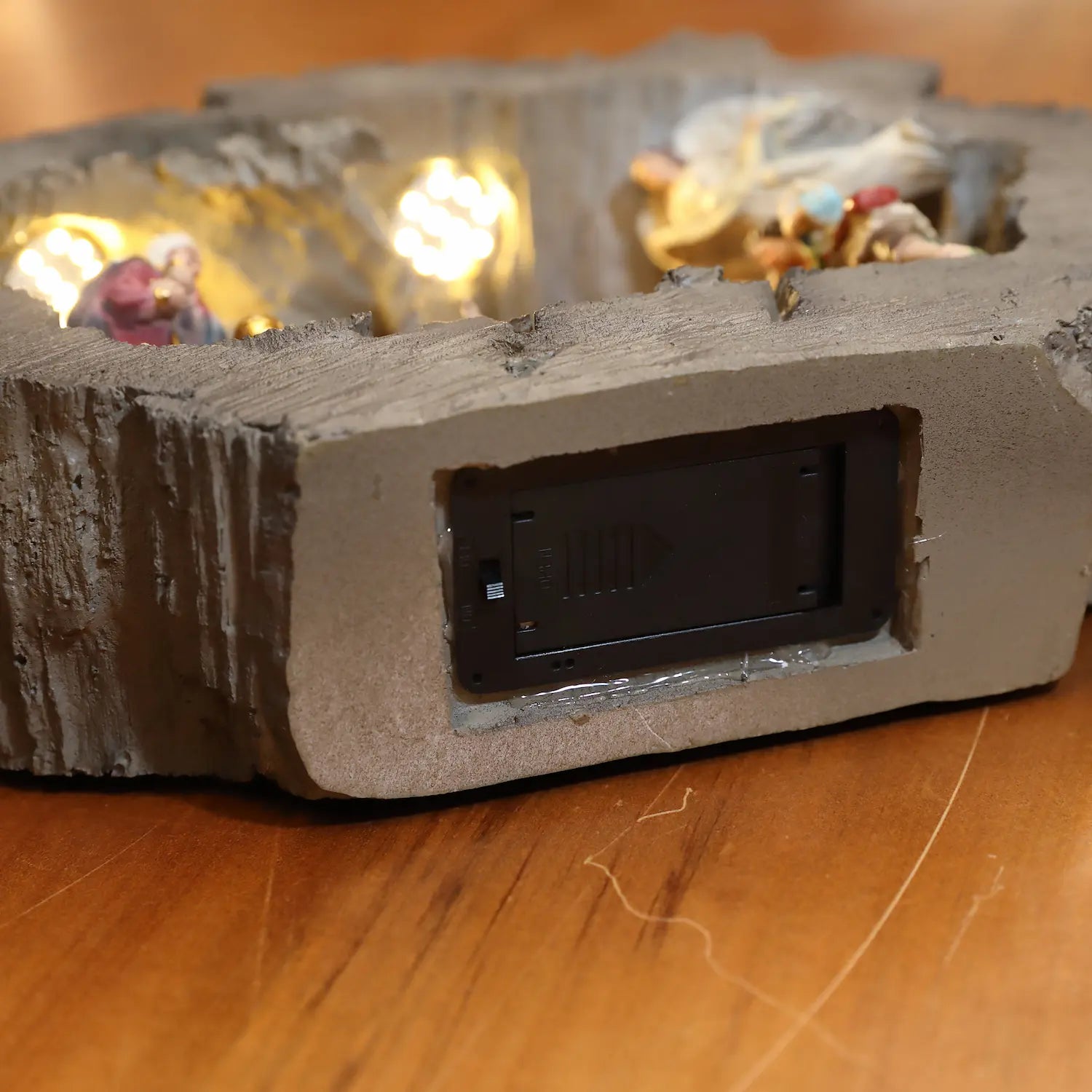  Detailed side view of LED Christmas nativity decoration with warm stable lighting