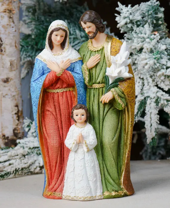 A one-piece religious figurine depicting the Holy Family (Mary, Joseph, and baby Jesus) standing together.