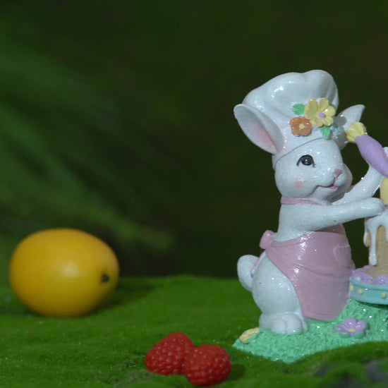 Light-up Easter bunny chef cake figurine rotating with glowing LED egg, hand-painted resin spring decoration by Zayton