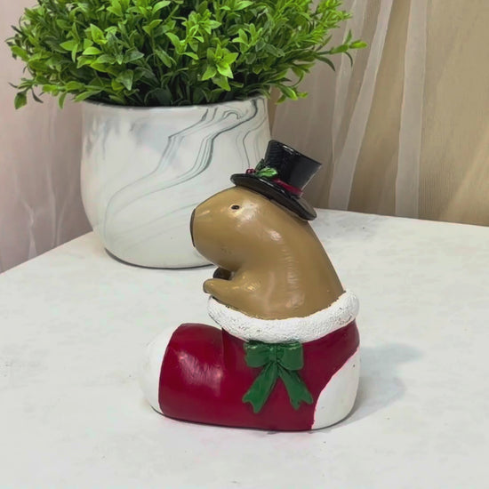 Capybara in stocking boot Christmas tabletop figurine
