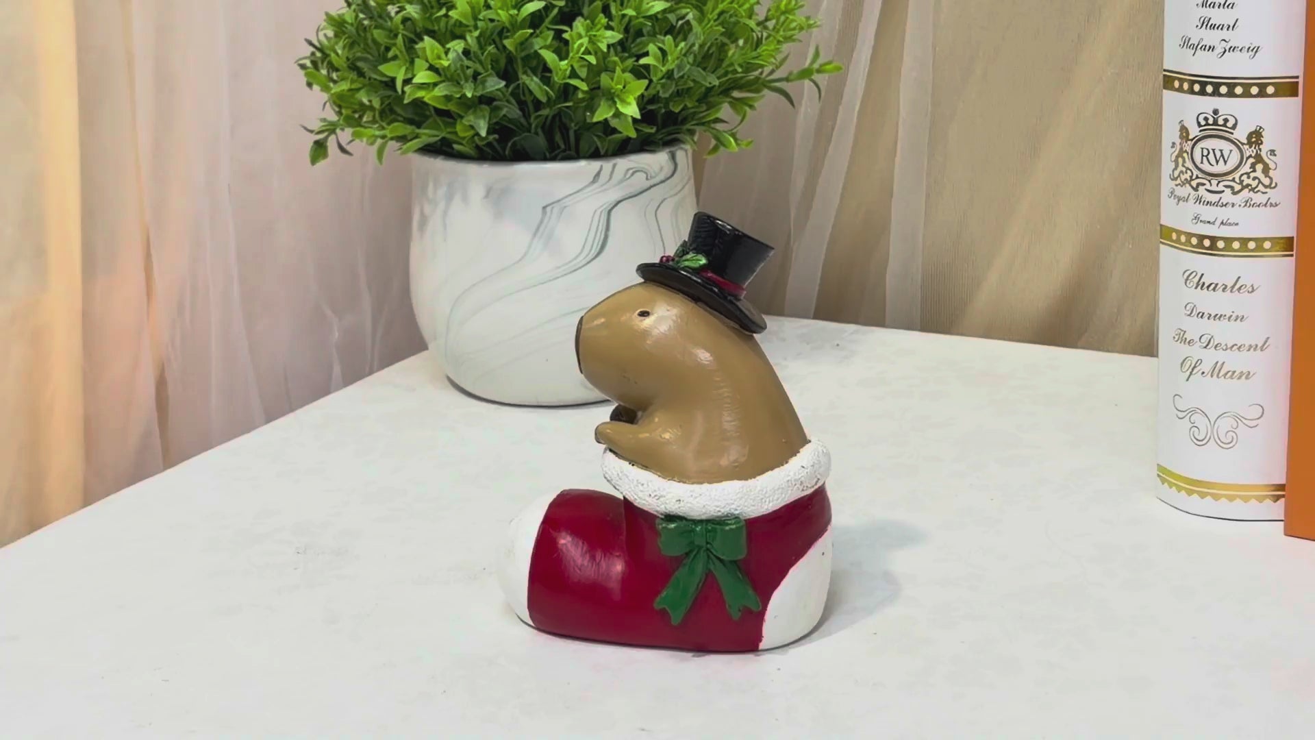 Capybara in stocking boot Christmas tabletop figurine