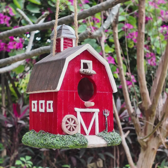 video of red resin birdhouse hand-painted
