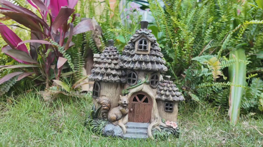 Solar squirrel fairy house rotating video showing pinecone roof details and glowing windows