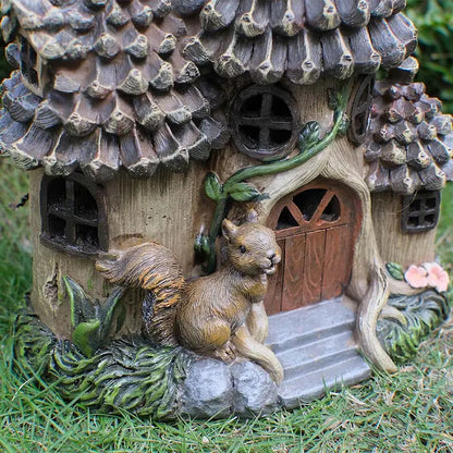squirrel figurine and wooden door on fairy garden house